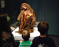 Children Viewing mummy Exhibit Mummies of the World photo